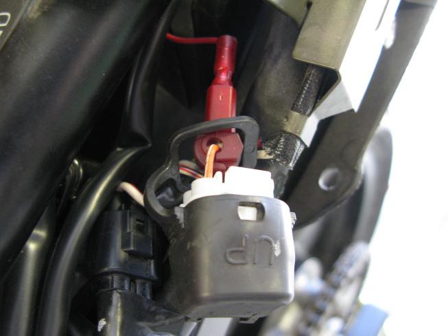 9. To finish the installation of the fuel harness, locate the factory diagnostic connector which can be found near the factory CKPS connector, in the tail section on the left side.