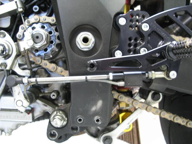 11. Now you will begin the installation of the Bazzaz quickshifter. Start by removing the factory shift rod and install the Bazzaz SHIFT SWITCH on the rear shift linkage.