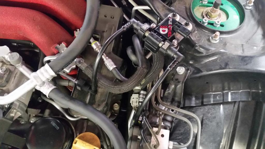 Fuel line installation: Remove the black & white protective covers from the fuel line.