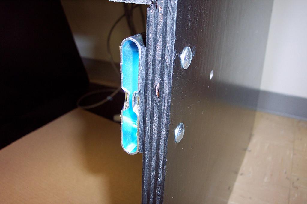Loosely install the cabinet latches using the 1/4-20 x 3" full thread bolts, nuts and