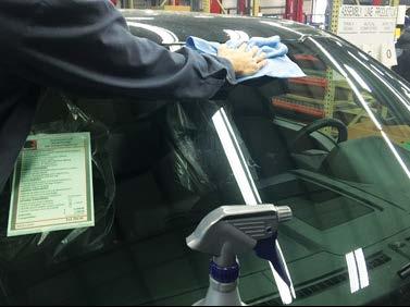 Place the windshield banner onto the windshield and align the top edge of the banner with the top edge of the glass.