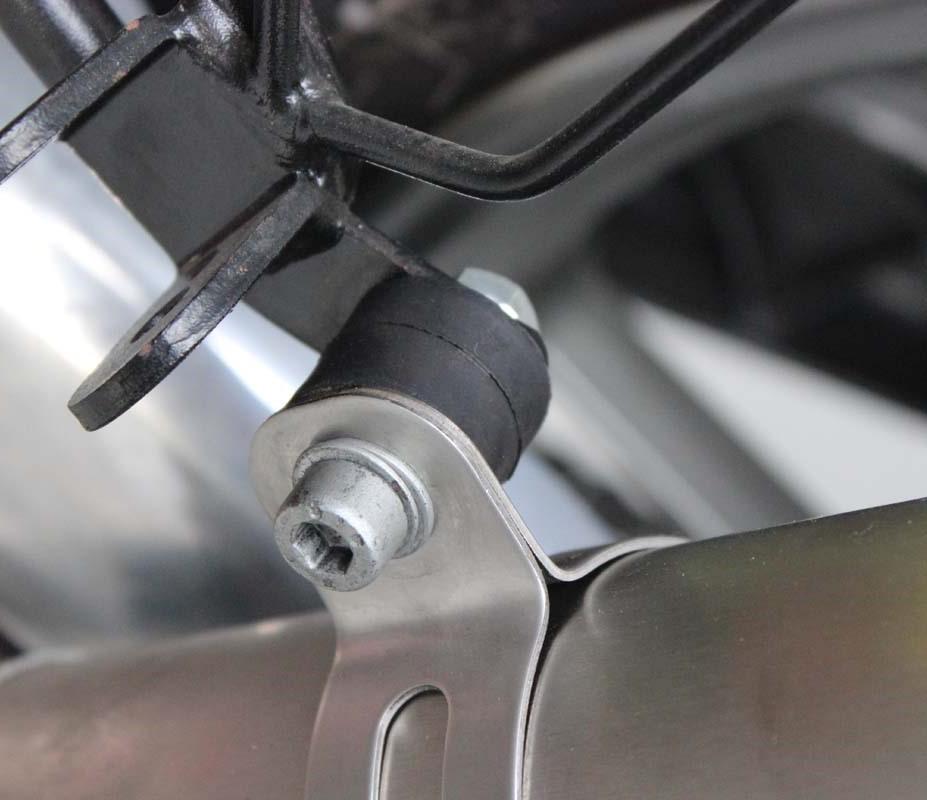 Next, remove the loosened bolt from the silencer and remove the complete exhaust system from the bike.