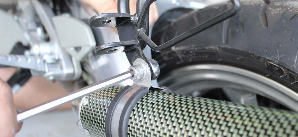 6) The exhaust system is supplied with a mounting clamp which holds the silencer in place on the bike.