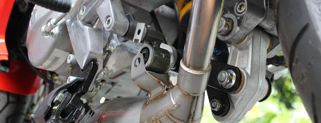 Attach the clamp and install the bolt to the stay but do not tighten yet. It could be that the exhaust sits too low or too high to be comfortable.