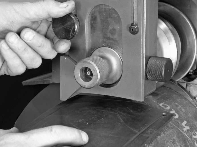 6. Loosen the knob on the side of the roll guards to drop the sliding
