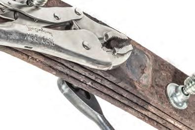 (see FIG 31) Using a wrench & locking pliers to hold the head of the OEM tie bolt, loosen & remove.