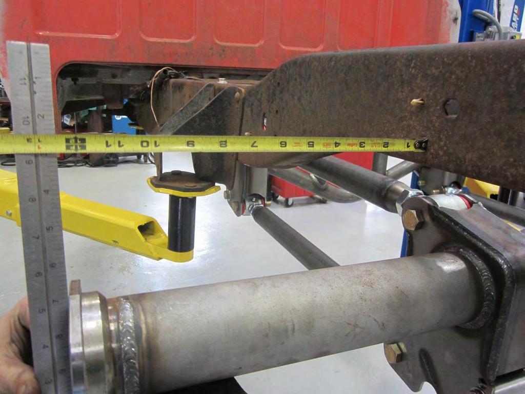 31) Measure from the front of the axle tube (Figure 60) to the start of the factory rivet (Figure 61). Measure both driver and passenger sides and adjust accordingly using the adjustable links.
