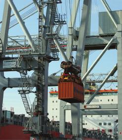 vehicles such as cranes, spreaders and stackers are used to transport containers from ship