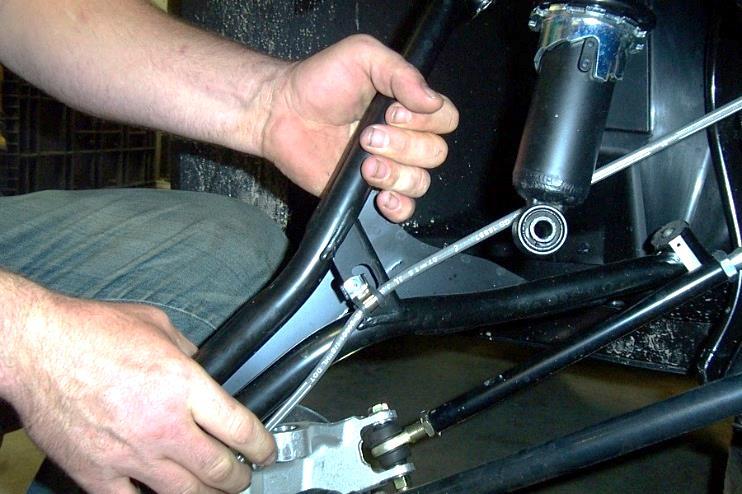 6. Next you will need to remove upper arm, but the brake line is riveted to the