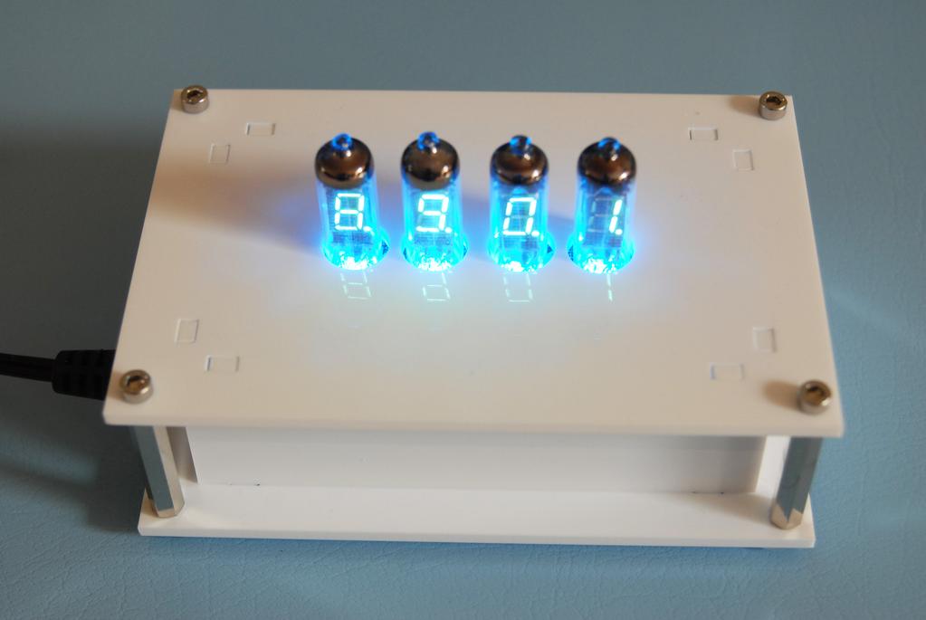 The decimal separator dots of the VFD tubes should form a binary 4 bit counter. Tube backlighting should dim and turn on again every few seconds.