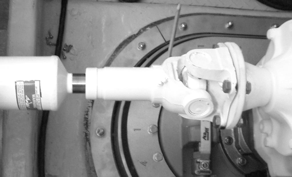 Section 5 - Mintennce Luriction Driveshft Slip Joint 1. Remove the top nd ottom driveshft shields on the trnsmission end s shown.