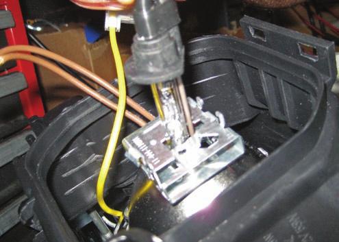 Remove the H1 HID bulb from the protective plastic casing and screw cap.