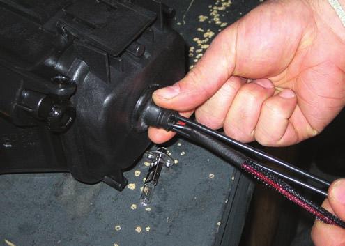 GENTLY pull on the wires while holding the rubber grommet firmly in place.