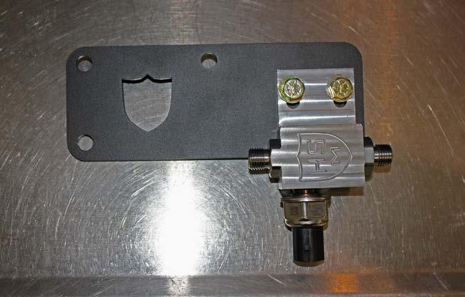 Loosely install the fuel distribution block onto the bracket using the 5/16 hardware as shown.
