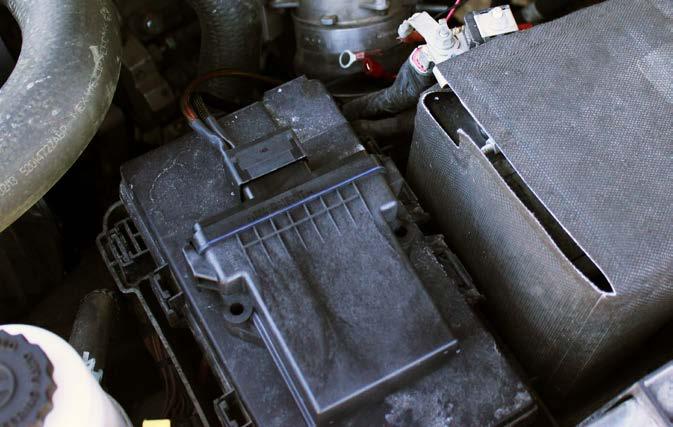 Find a suitable mounting location for the dual pump control module on the driver side of the engine bay and