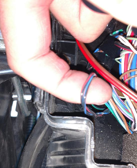 Locate the CAN communication wires under the engine bay fuse panel. They will be in the bundle of wires nearest the engine.