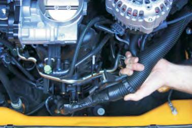25. Lift the electrical harness from the top of the engine and set off to