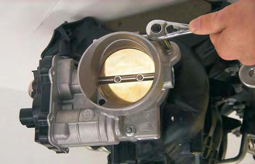 61. Using a 10mm socket wrench remove the stock throttle