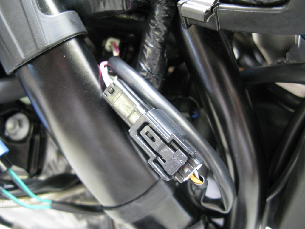 5. Locate the injector found on top of the throttle body. Disconnect the factory injector connector from the injector.
