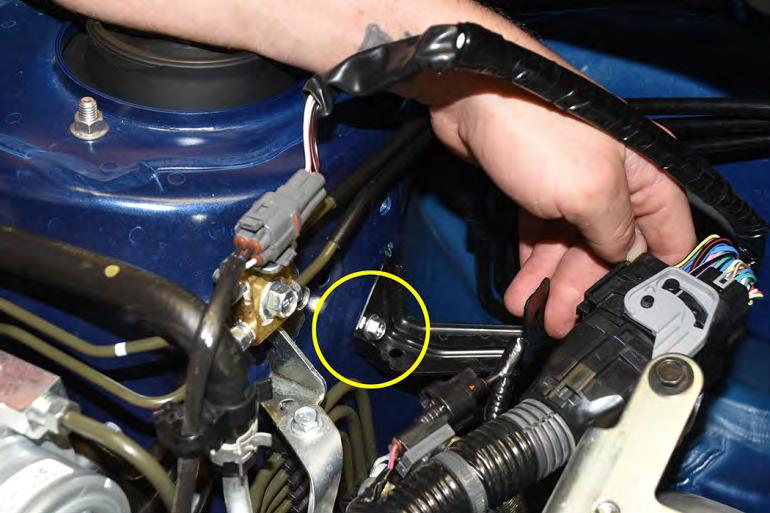 Remove main wiring harness bracket using 10mm socket and ratchet, it is