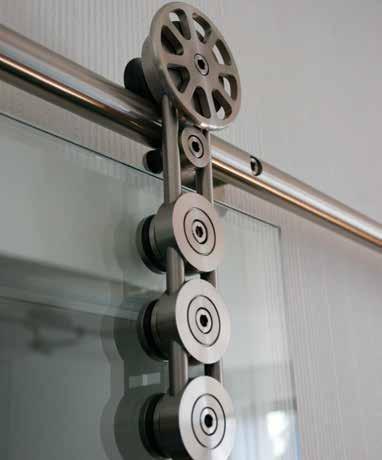 VISIBLE BARN DOOR SLIDING SYSTEMS SPIDER WALL-MOUNTED SLIDING SYSTEM FOR GLASS DOORS Barn door sliding max.