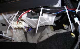(e) Secure the door sill wires to the OE harness 1.5 inches above the harness clip with one (1) wire tie. (Fig.