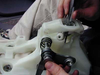 Page 3 9. Pull out the pin and the L shaped arm which was held on by the clip and remove the shifter. 10.