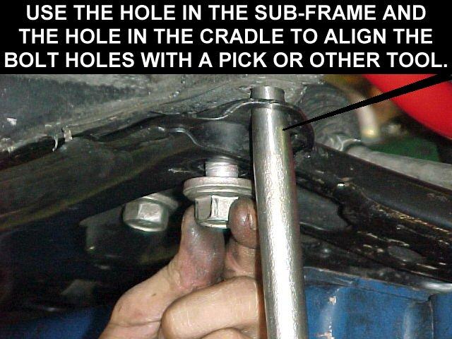 Replace the hardware mounting the cradle to the lower engine mount