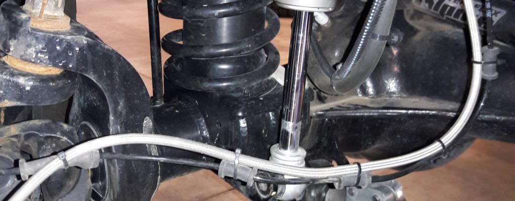 Install the front spring retainers and torque to 30 ft-lbs (40 Nm).