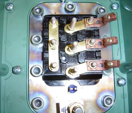 Remove cover and install the jumper bars to correspond to your system voltage (See Figures 2.16a and 2.16b).
