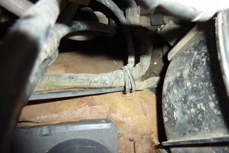 Note: It is located just behind the radiator on the passenger side inner fender.