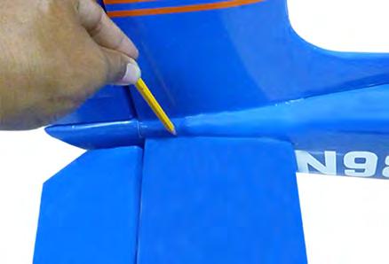 4) With the stabilizer held firmly in place, use a pen and draw lines onto the stabilizer where it and the fuselage sides meet.
