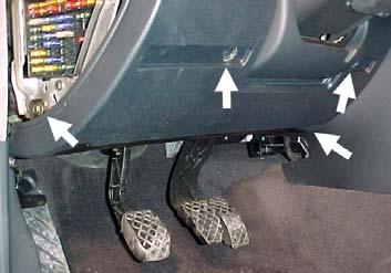 Step 3: Remove the driver side knee bolster below the steering column, and the fuse panel cover on driver s end of dash.