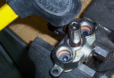 Remove the remaining two Hex Nuts from the Studs.