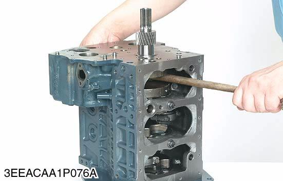 Piston 1. Turn the flywheel and bring the piston to top dead center. 2. Draw out the piston upward by lightly tapping it from the bottom of the crankcase with the grip of a hammer. 3.