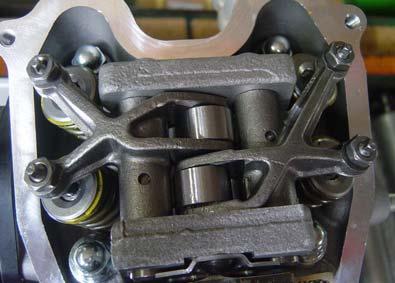 Thermostat housing bolt Derail the cam chain from the cam sprocket teeth and remove the