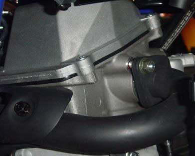 Loosen exhaust pipe front section to cylinder head mounting nuts.