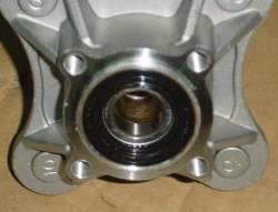 The bearing should turn smoothly and quietly. Check the outer race fits tightly in the hub.