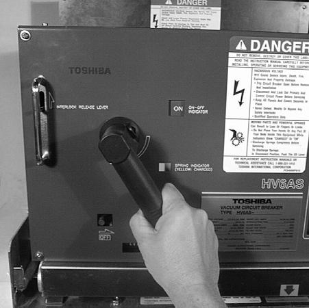 To avoid damaging the mechanism, do not close the circuit breaker when the On-Off Indicator shows ON (red). MANUAL CLOSING: Fig. 25 Preparing to Manually Close Breaker 1.