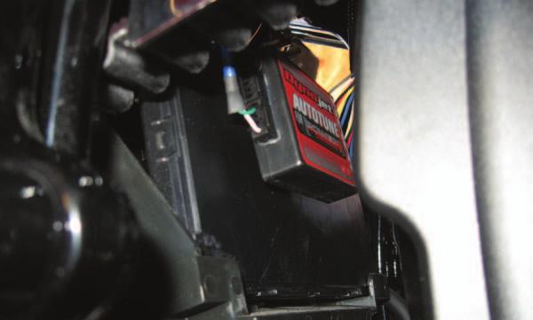 16 Route the power harness from the Auto tune thru the hole in the rear fender and connect to the diagnostic port. The diagnostic port is shown in Figure. A. FIG.