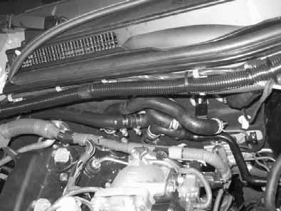 7 Mount coolant hose between heat exchanger outlet and engine