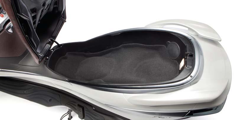 The helmet compartment is on the X10 125 and 350 is large enough for two flip up helmets, while the compartment on