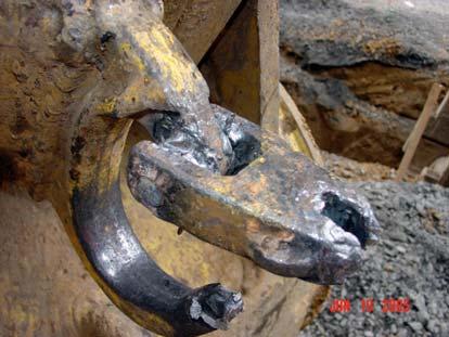 The steel ring connecting the two cables was attached to a J-hook on the arm of the track-hoe.