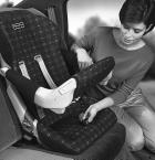 Restraining Your Child 1 After installing the car seat in your vehicle, lower the