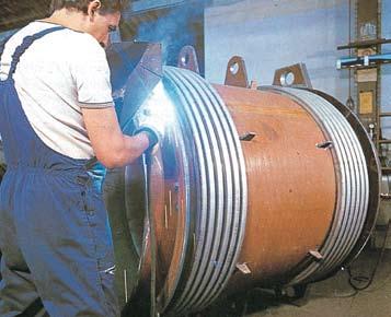 First of all a sheet of suitable material (usually stainless steel) is selected, cut, rolled to the correct size and welded longitudinally.