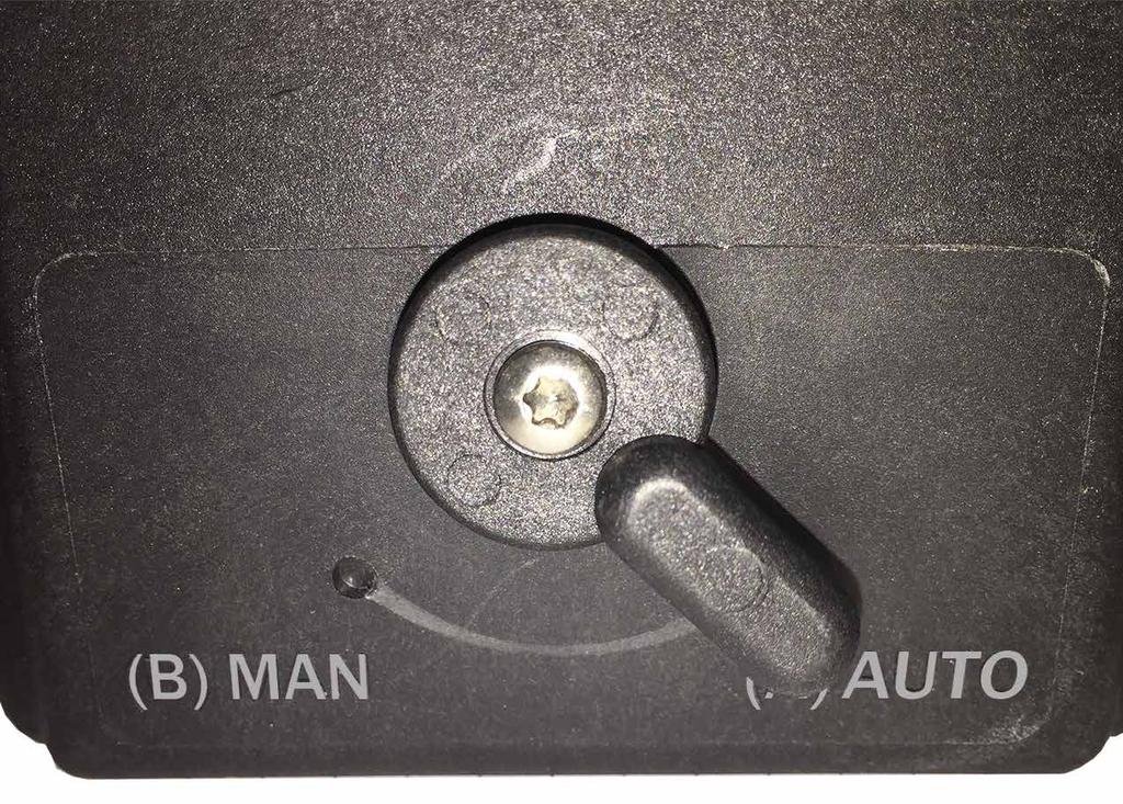 Declutch Lever in the (A) AUTO position (left) and the (B) MAN