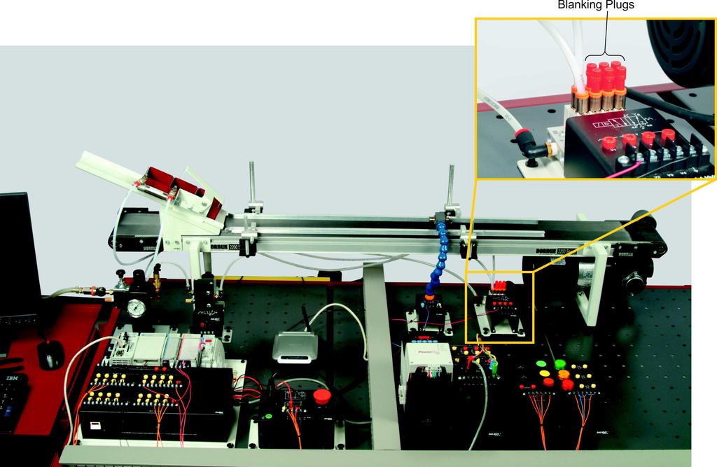Blnking Plugs Figure 4-23. PLC-controlled conveyor nd sensors setup.