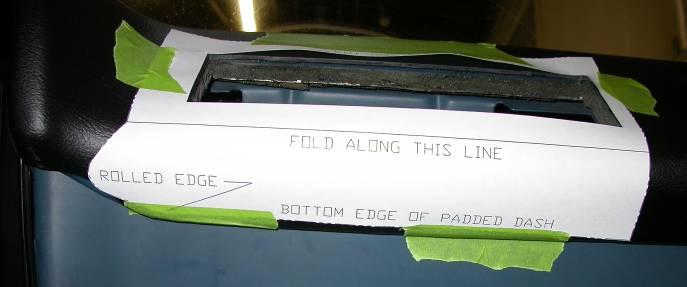 Locate left edge of template along rolled edge in the dash pad as shown.