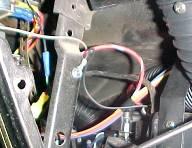 Locate ground wire from srevo motor harness and attach to the brace as shown. use (1) #10 tek screw.