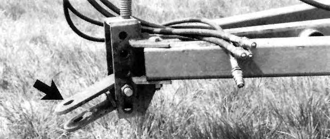 side. An appropriate number of depth control stops (FIGURE 7) had to be used on each master cylinder to set the desired tillage depth.